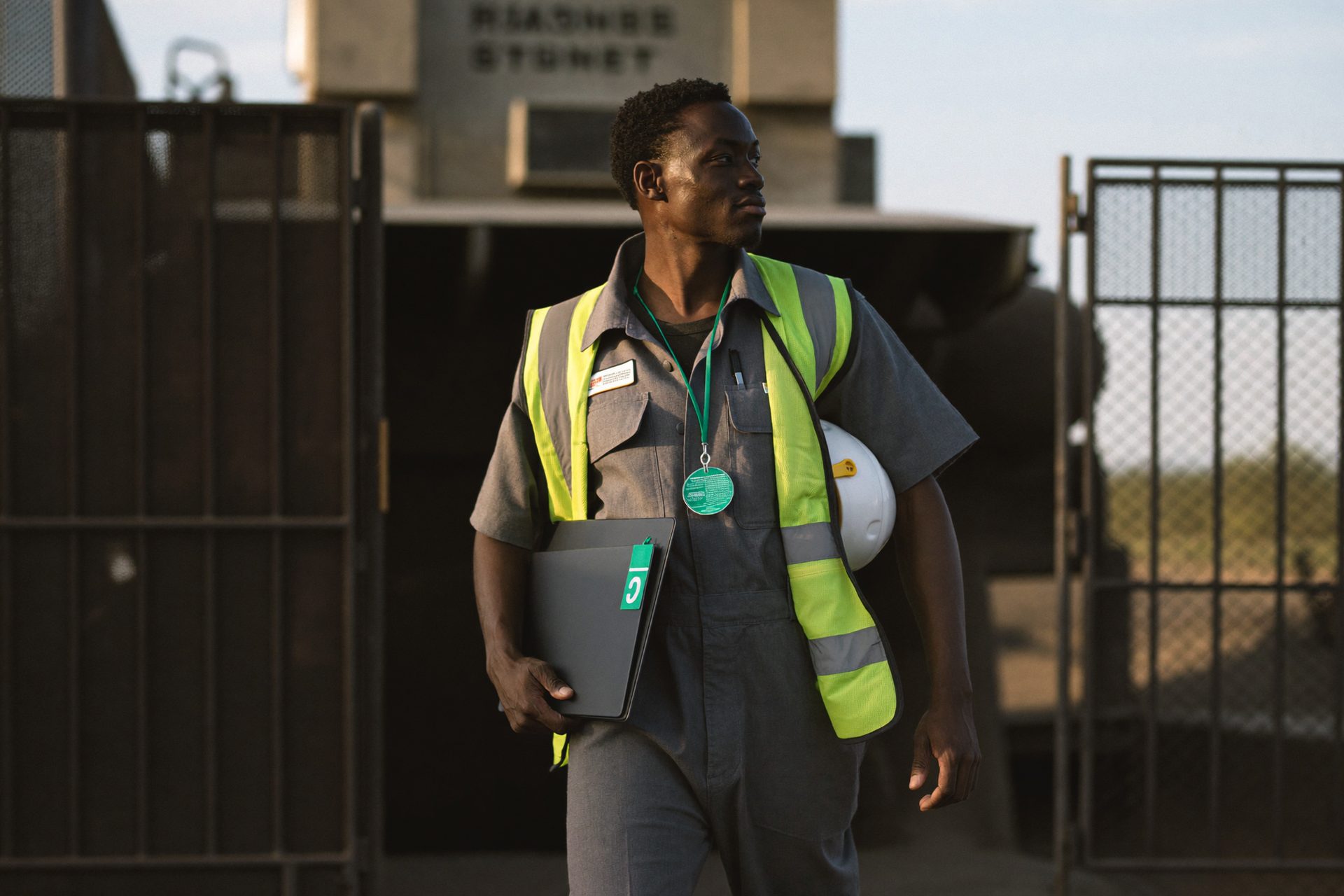 Contractor at an industrial site access point with a file